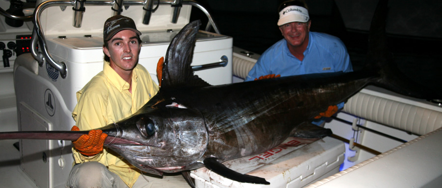 Victorious!  Nick Stanczyk and Poveromo, with the 256-pound swordfish that had Poveromo in the water during the early rounds.