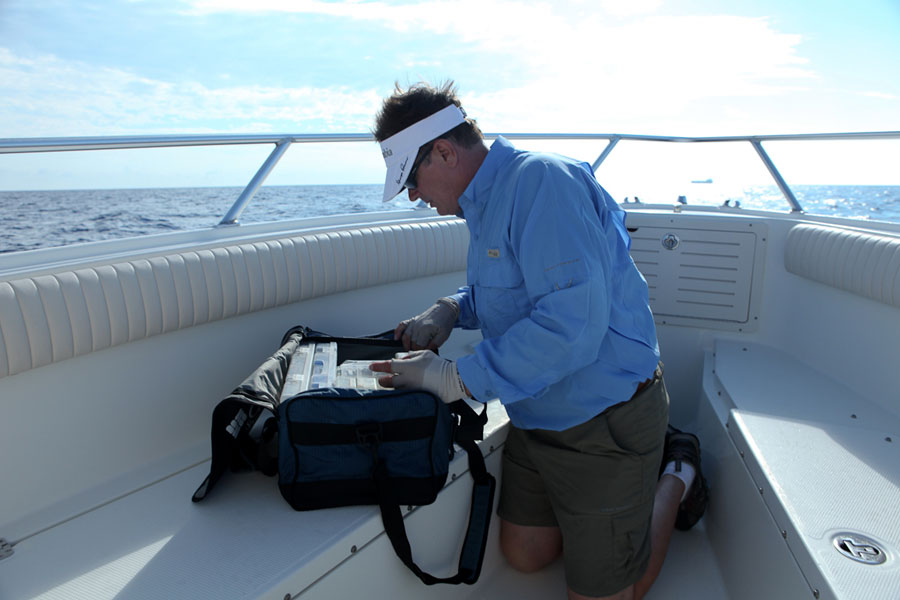 George Poveromo sorts through a soft-sided tackle bag designated for offshore terminal gear.