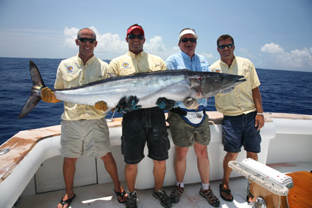 Poveromo and the Over-Under crew are all smiles after landing this 113-pound, two-ounce, wahoo!